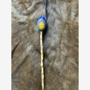 Trommestik i blommetr